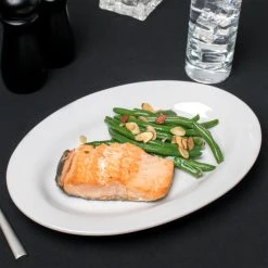 Acopa 12 1/2" X 8 3/4" Bright White Wide Rim Rolled Edge Oval Stoneware Platter - 12/Case