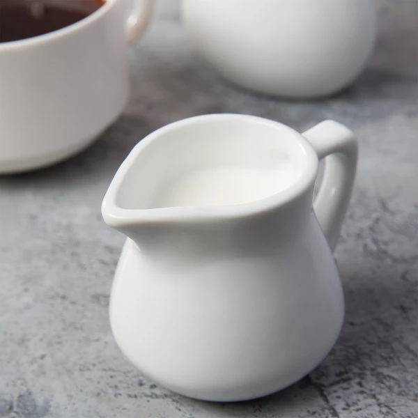 Acopa 3.5 Oz. Bright White Porcelain Creamer - 12/Pack 1 Acopa 3.5 Oz. Bright White Porcelain Creamer - 12/Pack