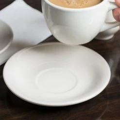 Acopa 6" Ivory (American White) Rolled Edge Stoneware Saucer - 6/Pack