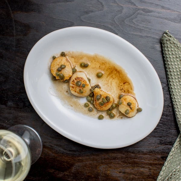 Acopa 9 3/4" X 7 1/2" Bright White Oval Coupe Stoneware Platter - 24/Case 3 Acopa 9 3/4" X 7 1/2" Bright White Oval Coupe Stoneware Platter - 24/Case - Image 3