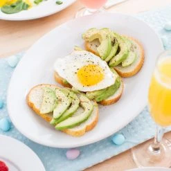 Acopa 13 3/4" X 10" Bright White Wide Rim Rolled Edge Oval Stoneware Platter - 12/Case -Acopa Sales 1580484