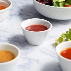 Acopa 4 Oz. Bright White Tapered China Sauce Cup - 12/Pack 10 Acopa 4 Oz. Bright White Tapered China Sauce Cup - 12/Pack -Acopa Sales 1607820