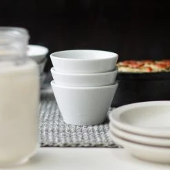 Acopa 4 Oz. Bright White Tapered China Sauce Cup - 48/Case 11 Acopa 4 Oz. Bright White Tapered China Sauce Cup - 48/Case -Acopa Sales 1781607