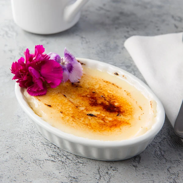 Acopa 5 Oz. Oval Bright White Fluted Porcelain Souffle / Creme Brulee Dish - 12/Pack 1 Acopa 5 Oz. Oval Bright White Fluted Porcelain Souffle / Creme Brulee Dish - 12/Pack