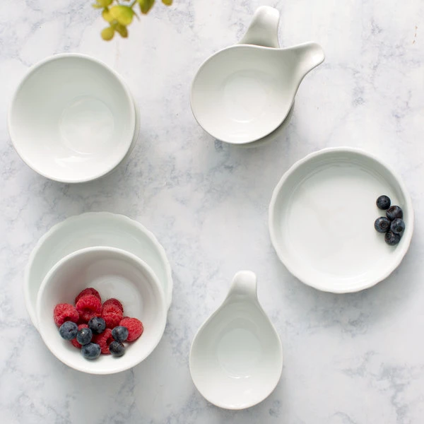Acopa 8 Oz. Round Bright White Fluted Porcelain Souffle / Creme Brulee Dish - 12/Pack 4 Acopa 8 Oz. Round Bright White Fluted Porcelain Souffle / Creme Brulee Dish - 12/Pack - Image 4