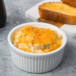 Acopa 10 Oz. Round Bright White Fluted Porcelain Souffle / Creme Brulee Dish - 12/Pack