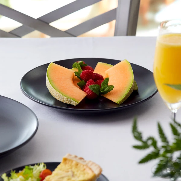 Acopa 7 1/4" Matte Black Stoneware Coupe Plate - 36/Case 1 Acopa 7 1/4" Matte Black Stoneware Coupe Plate - 36/Case