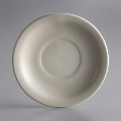World Tableware NR-2 Kingsmen White 5 1/2" Ultima Cream White Narrow Rim Round Stoneware Saucer - 36/Case
