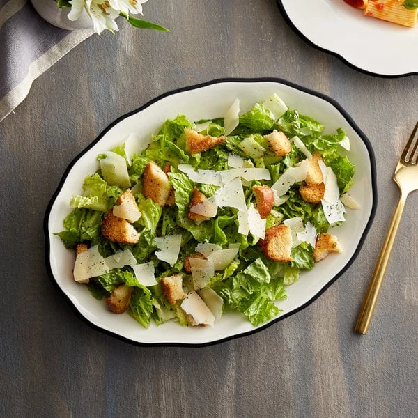 Acopa 11 5/8" X 8 1/2" Ivory (American White) Scalloped Edge Stoneware Platter With Black Band - 12/Case 1 Acopa 11 5/8" X 8 1/2" Ivory (American White) Scalloped Edge Stoneware Platter With Black Band - 12/Case