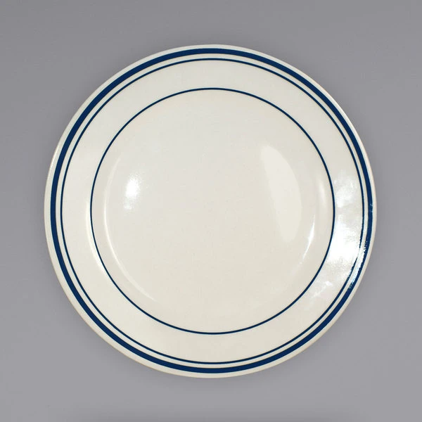 International Tableware CT-20 Catania 11" Ivory (American White) Stoneware Plate With Blue Bands - 12/Case 1 International Tableware CT-20 Catania 11" Ivory (American White) Stoneware Plate With Blue Bands - 12/Case