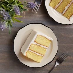 Acopa 7 3/8" Ivory (American White) Scalloped Edge Stoneware Plate With Black Band - 36/Case