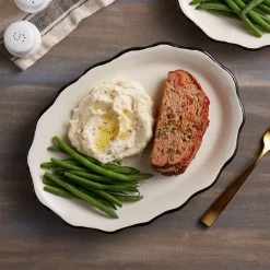 Acopa 12 5/8" X 9 1/4" Ivory (American White) Scalloped Edge Stoneware Platter With Black Band - 12/Case