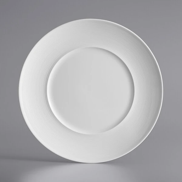 Acopa Liana 11 3/4" Bright White Embossed Lines Wide Rim Porcelain Plate - 12/Case 2 Acopa Liana 11 3/4" Bright White Embossed Lines Wide Rim Porcelain Plate - 12/Case - Image 2