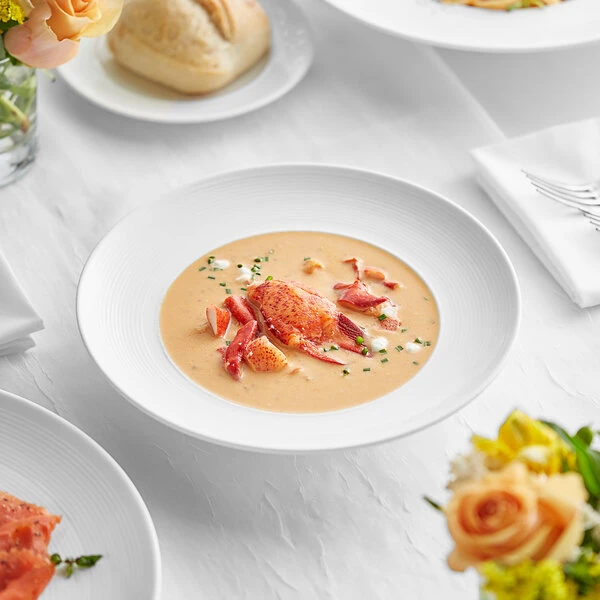 Acopa Liana 9 Oz. Bright White Embossed Lines Wide Rim Porcelain Soup Bowl - 12/Case 1 Acopa Liana 9 Oz. Bright White Embossed Lines Wide Rim Porcelain Soup Bowl - 12/Case