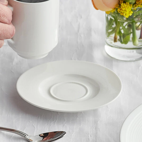 Acopa Liana 6" Bright White Embossed Lines Wide Rim Porcelain Saucer - 36/Case 1 Acopa Liana 6" Bright White Embossed Lines Wide Rim Porcelain Saucer - 36/Case