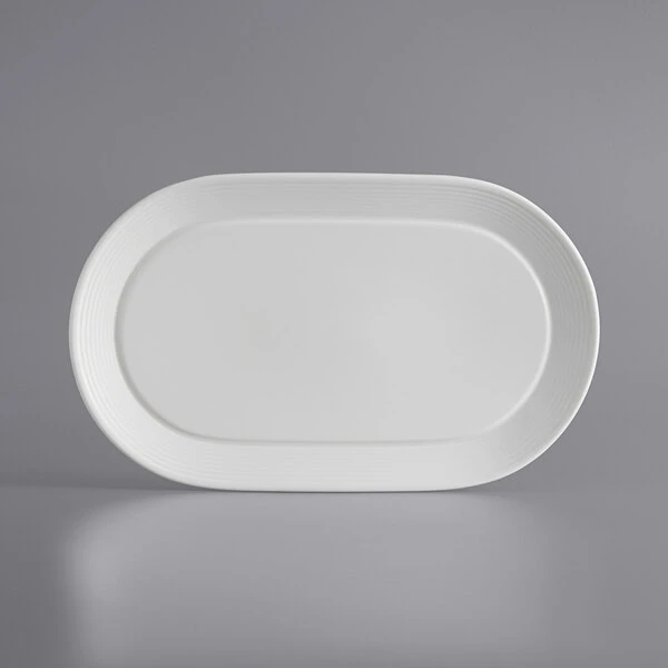 Sample - Acopa Liana 12" X 7 1/4" Bright White Embossed Lines Wide Rim Porcelain Platter 2 Sample - Acopa Liana 12" X 7 1/4" Bright White Embossed Lines Wide Rim Porcelain Platter - Image 2