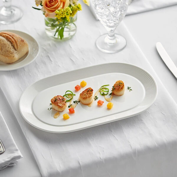 Sample - Acopa Liana 12" X 7 1/4" Bright White Embossed Lines Wide Rim Porcelain Platter 1 Sample - Acopa Liana 12" X 7 1/4" Bright White Embossed Lines Wide Rim Porcelain Platter
