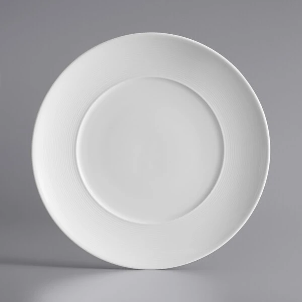 Sample - Acopa Liana 10 1/2" Bright White Embossed Lines Wide Rim Porcelain Plate 2 Sample - Acopa Liana 10 1/2" Bright White Embossed Lines Wide Rim Porcelain Plate - Image 2