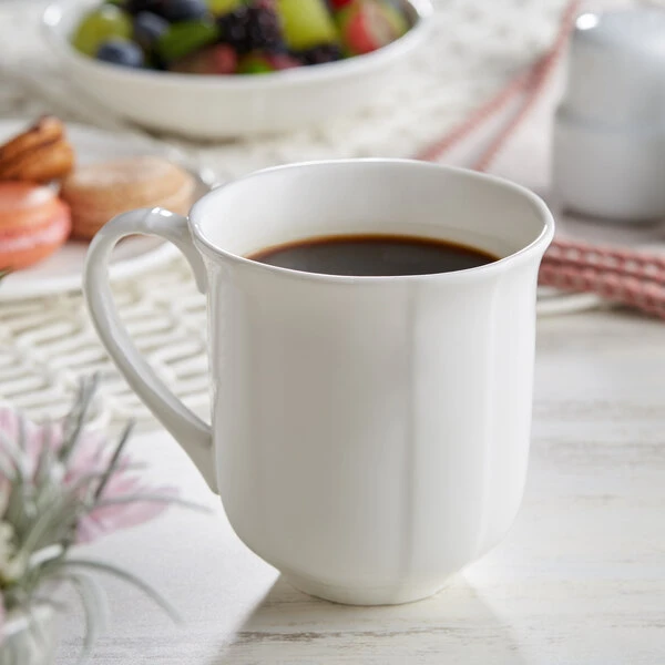 Acopa Condesa 12 Oz. Pearl White Scalloped Porcelain Mug - 36/Case 1 Acopa Condesa 12 Oz. Pearl White Scalloped Porcelain Mug - 36/Case
