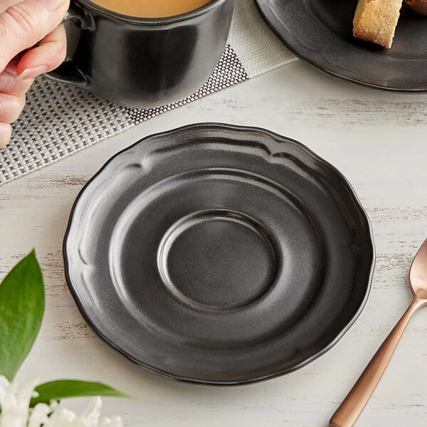 Acopa Condesa 6" Matte Finish Armor Gray Scalloped Porcelain Saucer - 36/Case 1 Acopa Condesa 6" Matte Finish Armor Gray Scalloped Porcelain Saucer - 36/Case
