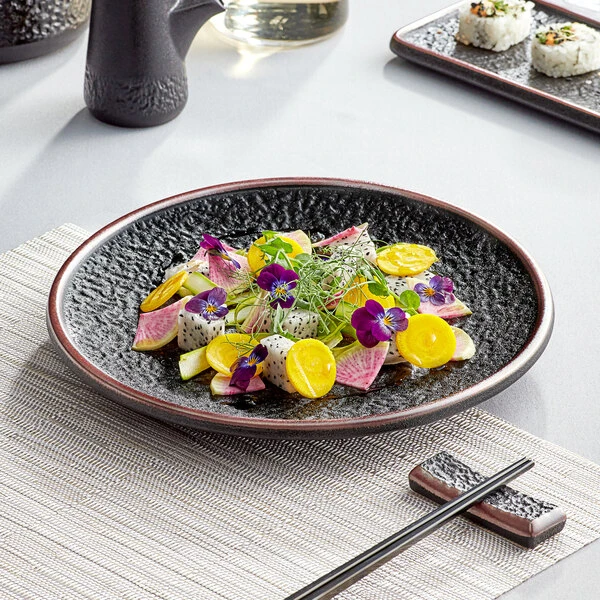 Acopa Heika 10" Black Matte Textured Coupe Stoneware Plate - 12/Case 1 Acopa Heika 10" Black Matte Textured Coupe Stoneware Plate - 12/Case