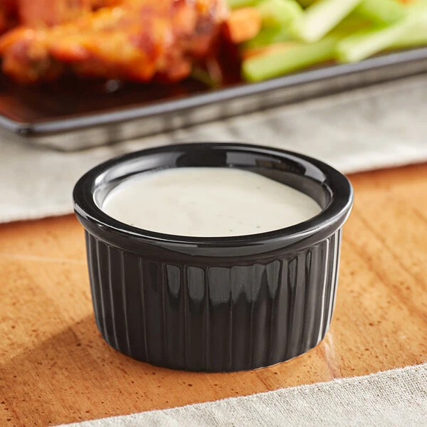 Acopa 2.5 Oz. Glossy Black Fluted Stoneware Ramekin - 48/Case 1 Acopa 2.5 Oz. Glossy Black Fluted Stoneware Ramekin - 48/Case