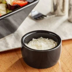 Acopa 2 Oz. Glossy Black Smooth Stoneware Ramekin - 48/Case