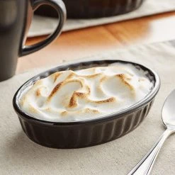 Acopa 5 Oz. Oval Glossy Black Fluted Stoneware Souffle / Creme Brulee Dish - 36/Case