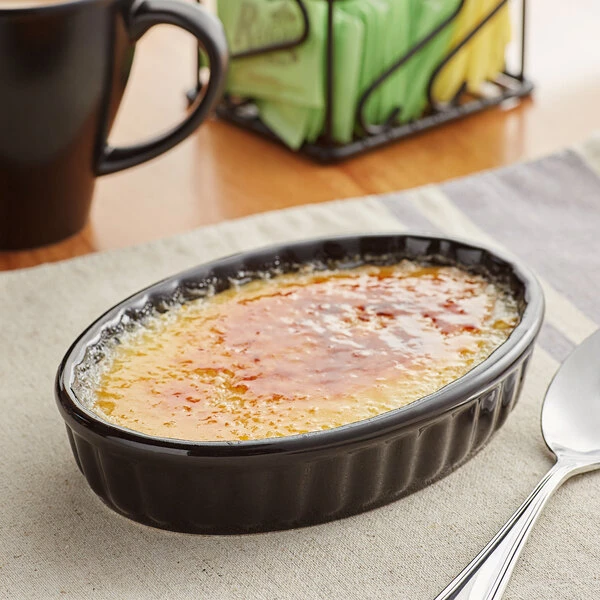 Acopa 6 Oz. Oval Glossy Black Fluted Stoneware Souffle / Creme Brulee Dish - 36/Case 1 Acopa 6 Oz. Oval Glossy Black Fluted Stoneware Souffle / Creme Brulee Dish - 36/Case