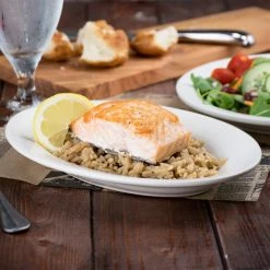 Acopa 9 3/8" X 6 1/2" Ivory (American White) Wide Rim Rolled Edge Oval Stoneware Platter - 24/Case 6 Acopa 9 3/8" X 6 1/2" Ivory (American White) Wide Rim Rolled Edge Oval Stoneware Platter - 24/Case -Acopa Sales 982339